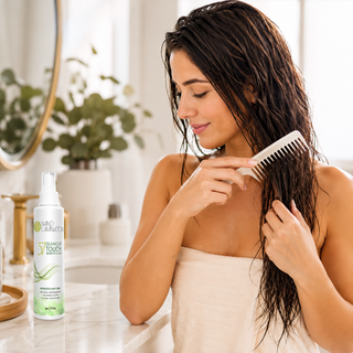 Woman combing damp hair after using Glamour Touch Leave-In Conditioner Spray